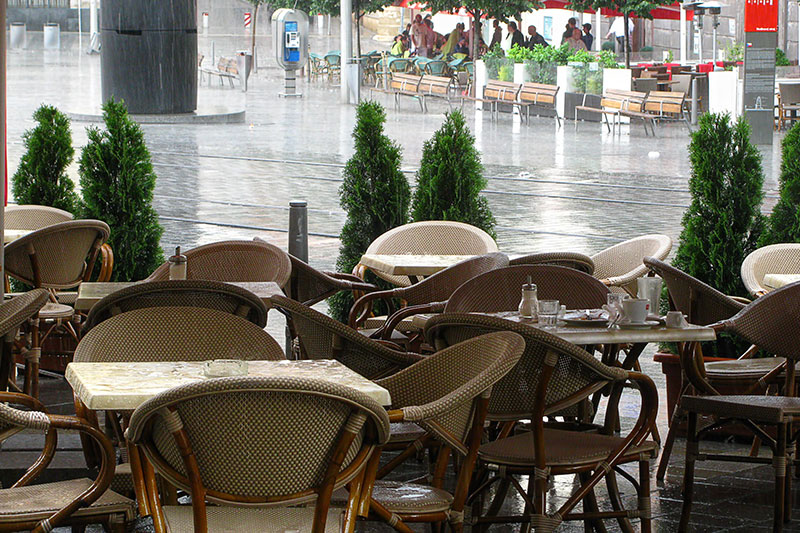 Rain outside a cafe in Paris